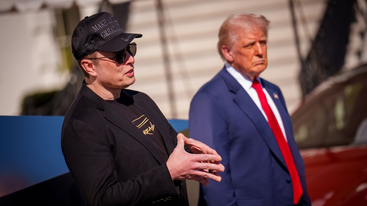WASHINGTON, DC - MARCH 11: U.S. President Donald Trump listens as White House Senior Advisor, Tesla and SpaceX CEO Elon Musk, speaks next to a Tesla Cyber Truck and a Model S on the South Lawn of the White House on March 11, 2025 in Washington, DC. Trump spoke out against calls for a boycott of Elon Musk's companies and said he would purchase a Tesla vehicle in what he calls a 'show of confidence and support' for Elon Musk. (Photo by Andrew Harnik/Getty Images)
