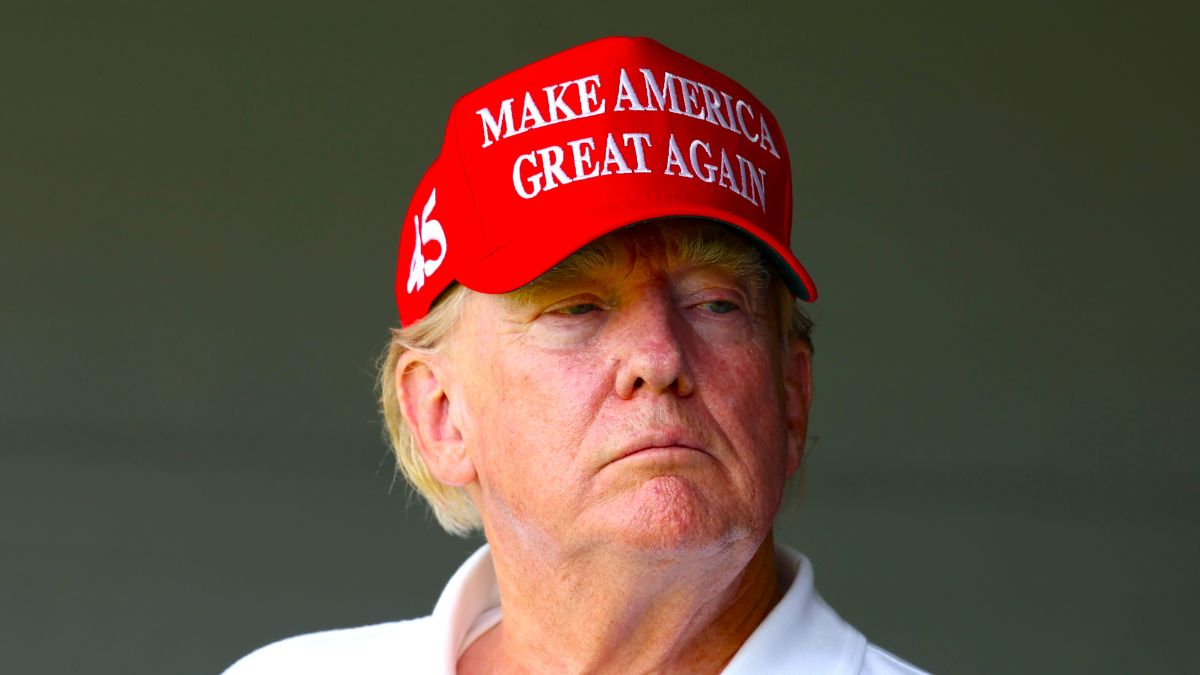Former US President Donald Trump watches from a box on the 18th green during day one of the LIV Golf Invitational - DC at Trump National Golf Club on May 26, 2023 in Sterling, Virginia. (Photo by Rob Carr/Getty Images)