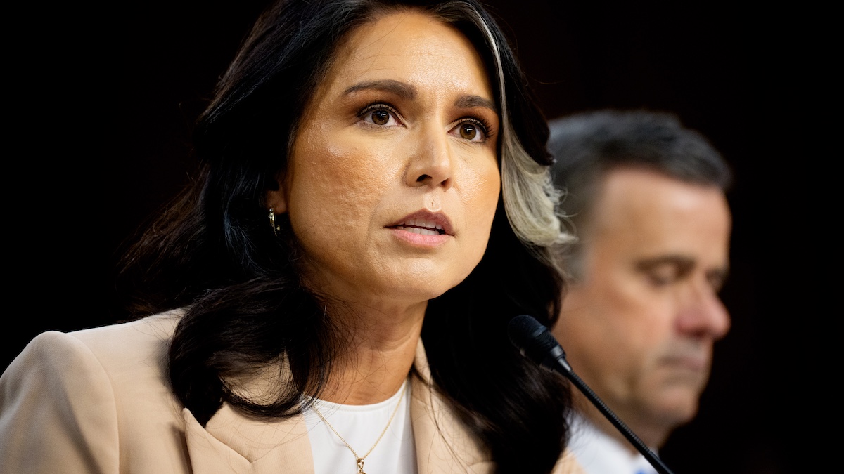 WASHINGTON, DC - MARCH 25: Director of National Intelligence Tulsi Gabbard (L) accompanied by Central Intelligence Agency Director John Ratcliffe (R), speaks during a Senate Committee on Intelligence Hearing on March 25, 2025 in Washington, DC. The hearing to examine worldwide threats comes a day after Jeffrey Goldberg, the editor-in-chief for The Atlantic magazine was inadvertently included on a high level Trump administration Signal group chat on bombing plans in Yemen on Houthi targets.